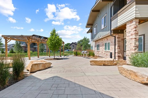 the preserve at ballantyne commons community walkway with trees and rocks